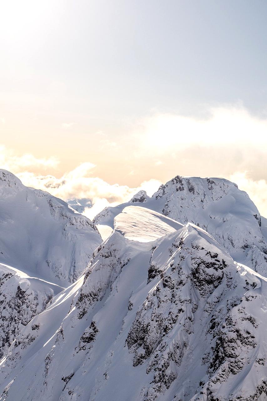 Snowy mountain peaks under clear blue sky in the Swiss Alps
